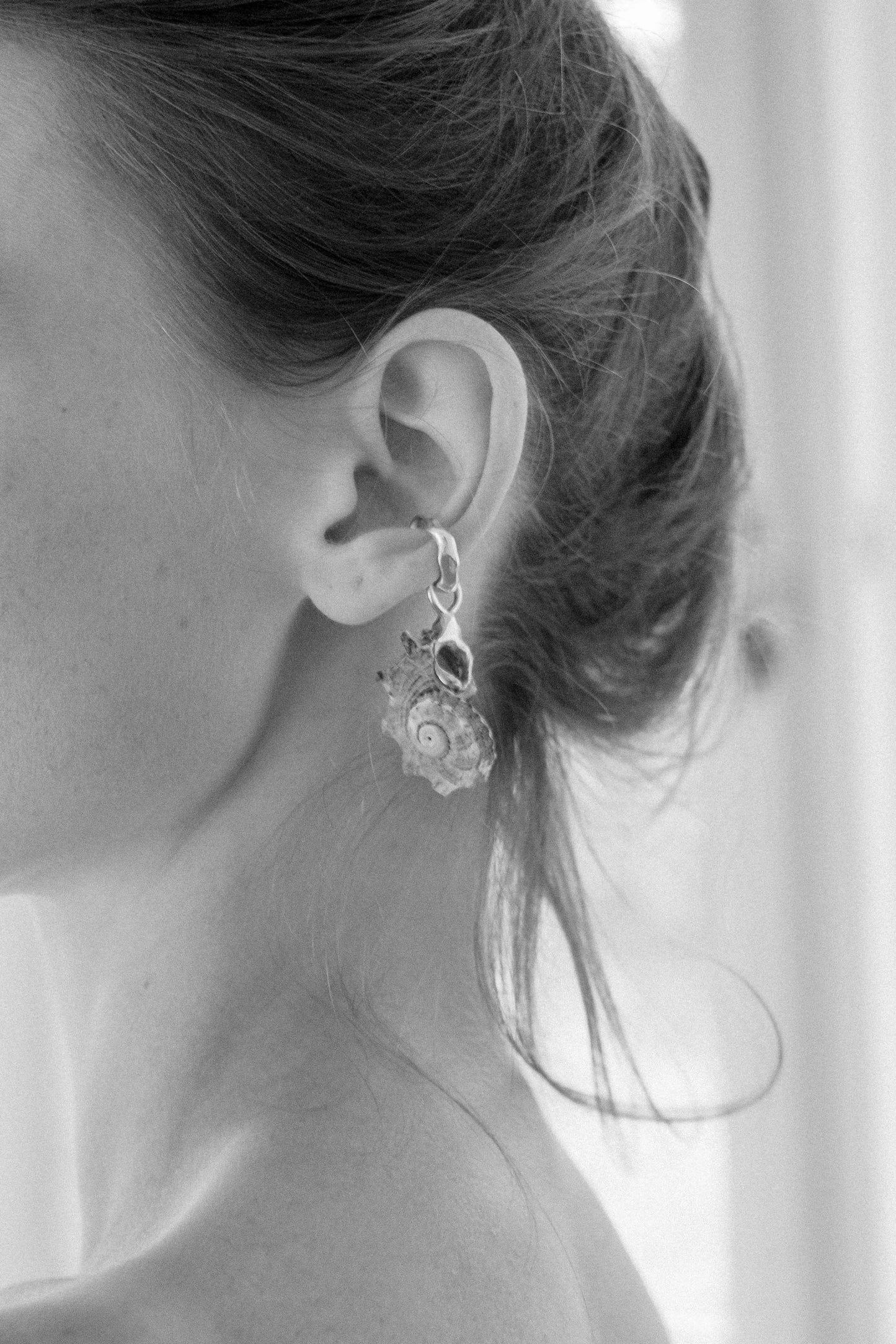 Mauve-hued Shell, Held in Sterling Silver
